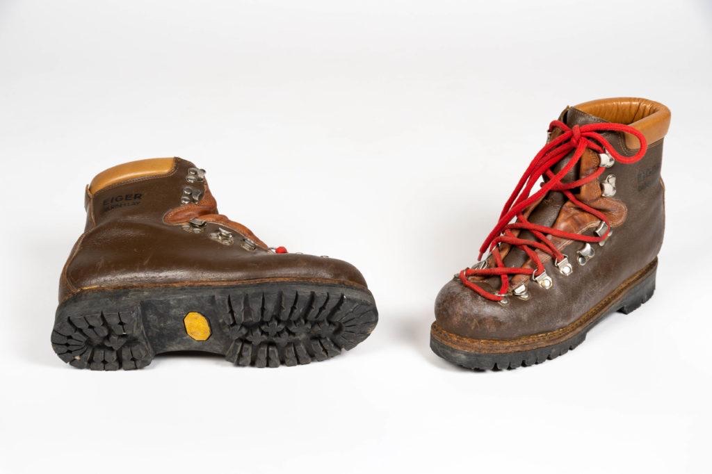 Pair of brown leather mountain boots with the yellow Vibram octagon visible on the sole